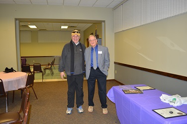 Butch, standing next to ER John receives his 50 year pin.  The big smile on his face is what being a Cortland Elk Member for 50 years will do to you.