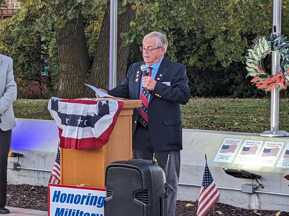Exalted Ruler Jerry Evans welcoming Veterans and Guests to the re-dedication of the Veterans Memorial October 20, 2023.  100 new bricks, 1 new bench and a fountain were added to the memorial.