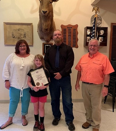 COVID-19 delayed the award presentation a few months but couldn’t dampen this champion’s smile. Alleigh Barriger, Soccer Shoot National Champion, girls U-8 division, was presented her certificate of achievement, champion’s pin & congratulatory letter from the GER.
Pictured with Alleigh (L-R) are Brenda Harrison, PDDGER; Zach Novotny, Exalted Ruler; and Frank Springer, Grand IG. Also attending the ceremony were Mid-America Soccer Shoot Chairman, Loren Anthony with his wife Jackie, and DDGER Kathy Clark with her husband Tom. 
Alleigh is the daughter of Nick & Tia Barriger. Chanute Lodge 806 hosted a dinner with Alleigh and her family after the presentation.