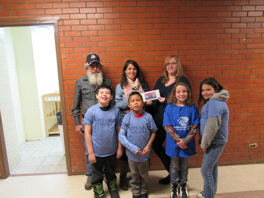 Salida Elks Lodge 808 ER Jim DeLuca back left and Leading Knight Brandi Pugh back right with the Anniversary Grant donation to Boys and Girls Clubs of Chaffee County