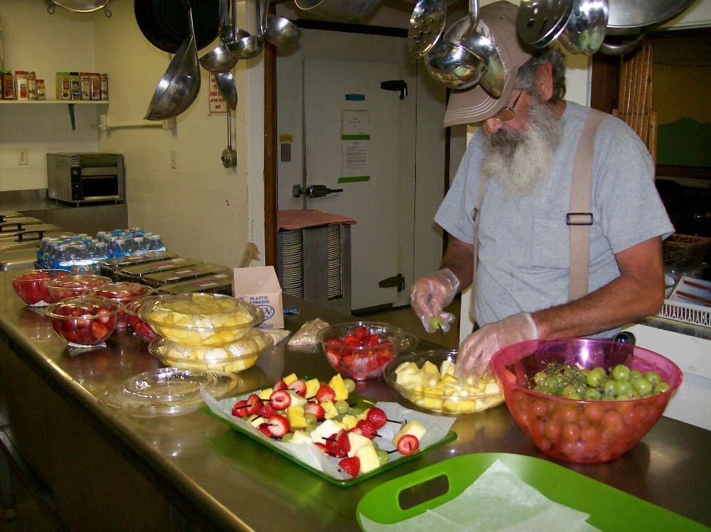 ER Jim making snacks for kids in our bike/ book event at Library in the park