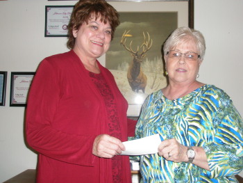 ER Stephanie Radford presents lodge $1,000.00 donation to Joni Cannon (Director) for the Cap The Gap program June 2013.
