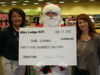 Shoe Party 12/17/12 Check presentation. Kathy Hall, Santa and Angel Blackwell