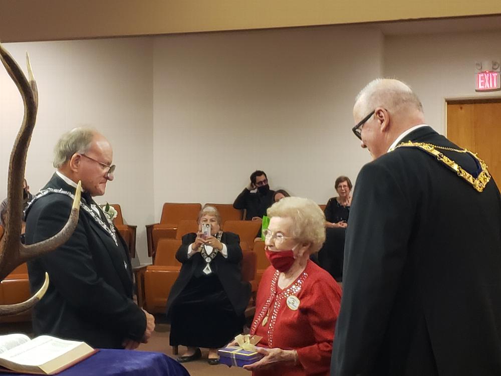 Here we have the ever lovely Peggy Cranford and Mike Gilligan gifting the elks tooth passed from Smitty to Gene, and now on to Hal.