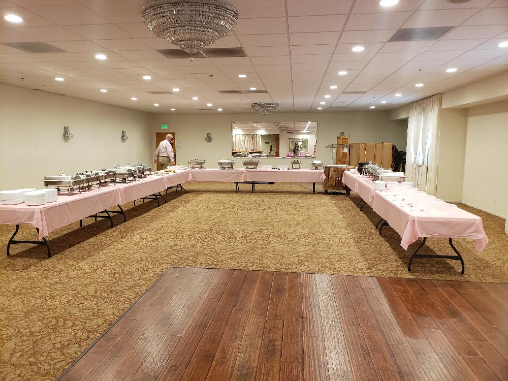 Buffet line set up, prior to all of the food being brought in.