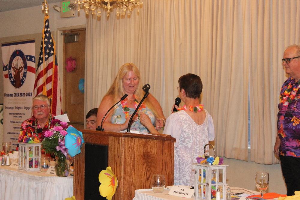 Emblem Club President Pamela Stein presenting the Emblem Club's CHEMPI donation.