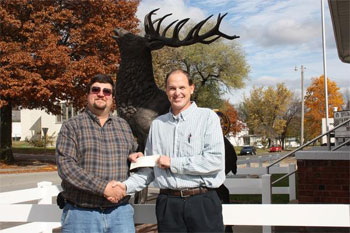 Exalted Ruler Larry Shew presents YMCA Director Lorin Affelt with a check to fund YMCA Youth Programs