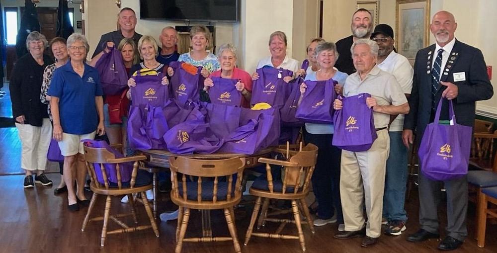 Fredericksburg Elks packed bags Monday July 24, 2023 for Mary's Shelter.  22 bags for children and 22 bags for mothers were packed with supplies, books, and Drug Awareness information.  Pictured (L to R) Fran McCauley, Pat Zaccagni, Elizabeth Dameron, Pam McCleod, Leading Knight Chris Jourdan, Nancy and Dave Winkler, Harriet Rowe, Carol Baker, Lisa Baker, Treasurer Charlotte Leitch, Kathleen Kennedy, Frank Brooks, Trustee Linnie Lee Baker, Alfredo Evans, ER Joe Toscano