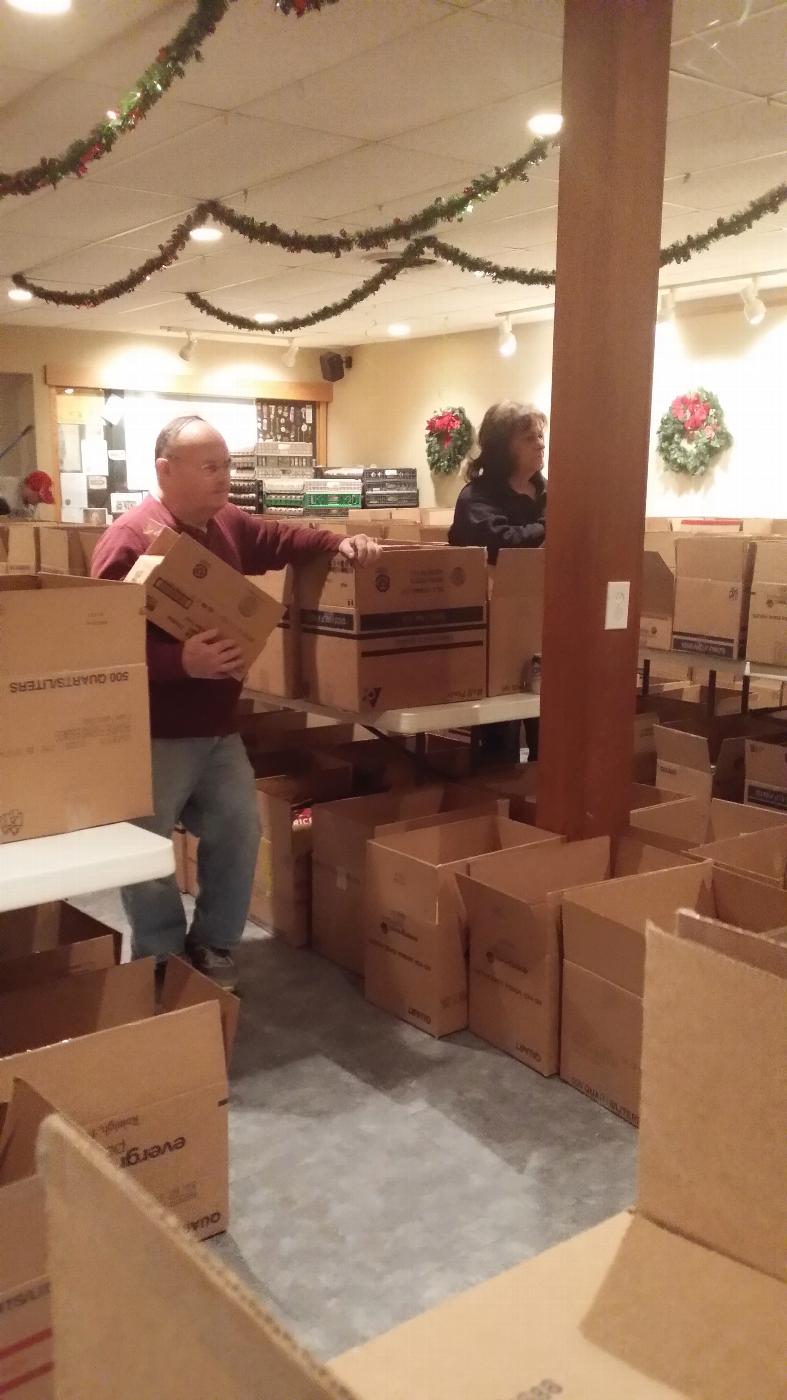PER Gerald (Spense) and member Sandy packing some of the 428 Christmas Baskets 2014.