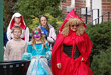 Drug Awareness Committee Chair Lyni McCreary, PEY, leads the Halloween parade from Bath's riverfront park to the Lodge for the 2013 children's Halloween party.