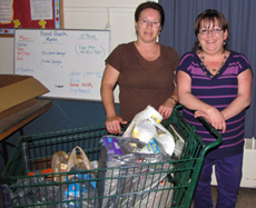 Entertainment Committee chair Mechelle Nash delivers food, collected in the lounge over a few weeks' time, to the Bath Area Food bank.