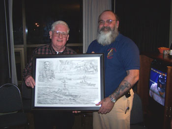 During the MEA State Convention, PER Leon "Mac" McCreary presents ME State Sponsor, PGER Amos McCallum (Biddeford-Saco ME, #1597) a memento of his tour at BIW.