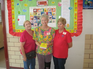 Sammie Pate, Merre'dithe Welch, and Sandra Shaw (ENF Committee) delivering dictionaries to third graders in Gulfport, MS. 