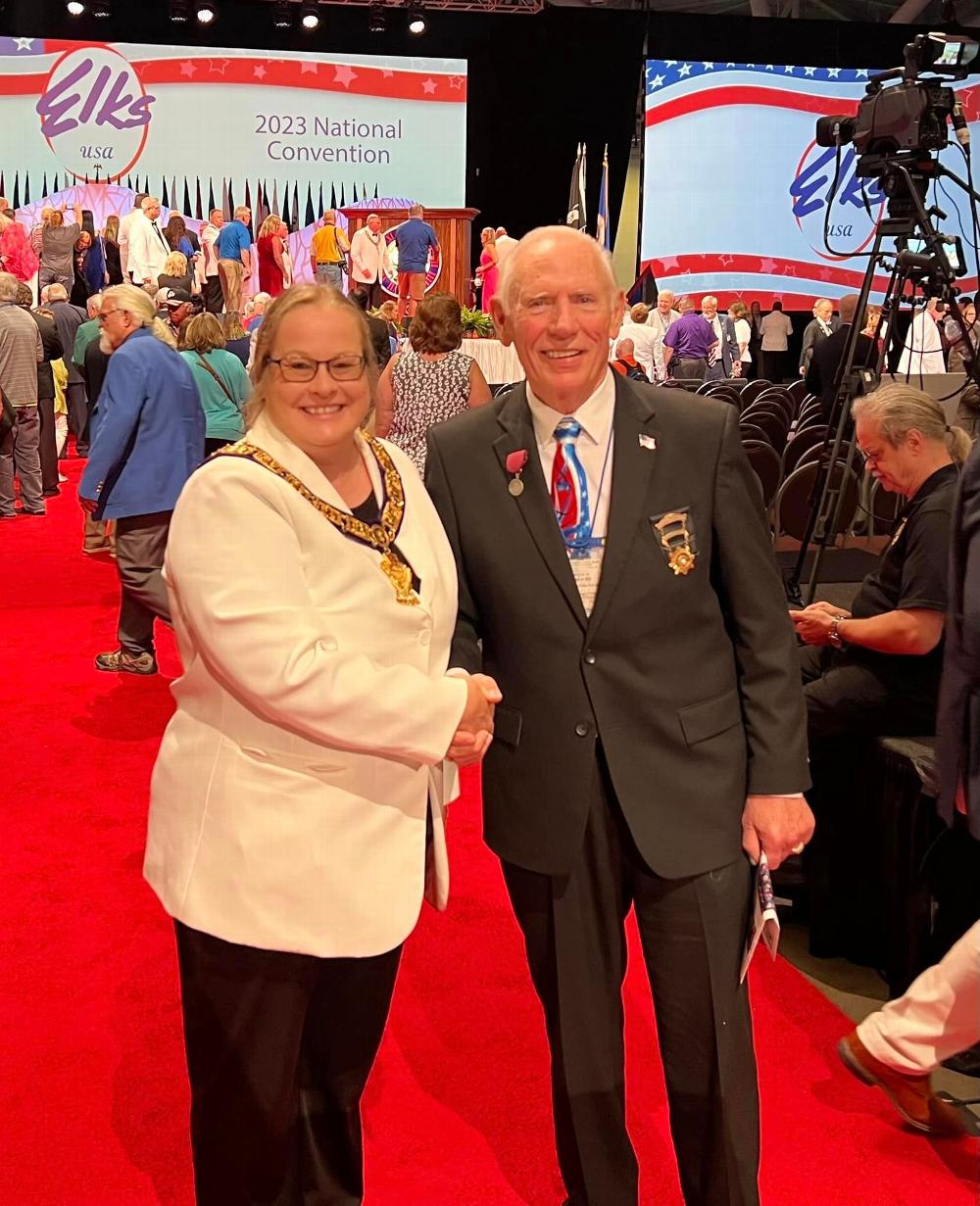 District Deputy G.E.R.Sheri McCord being congratulated by Texas Sponsor, Honorable John Amen on July 5, 2023 at the Grand Lodge Convention