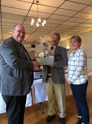 ER Steve Gregory presenting State President Brian Greene and First Lady Tonia Balfour with a gift during their visit to the Owego Lodge