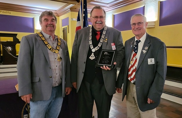 ER Steve Gregory looks on as Secretary & PER Tim Sayers accepts the New York State Elks Association ENF Chair Challenge Award, Division 1 (score of 431), from PSP & District Sponsor Phil Holowacz.