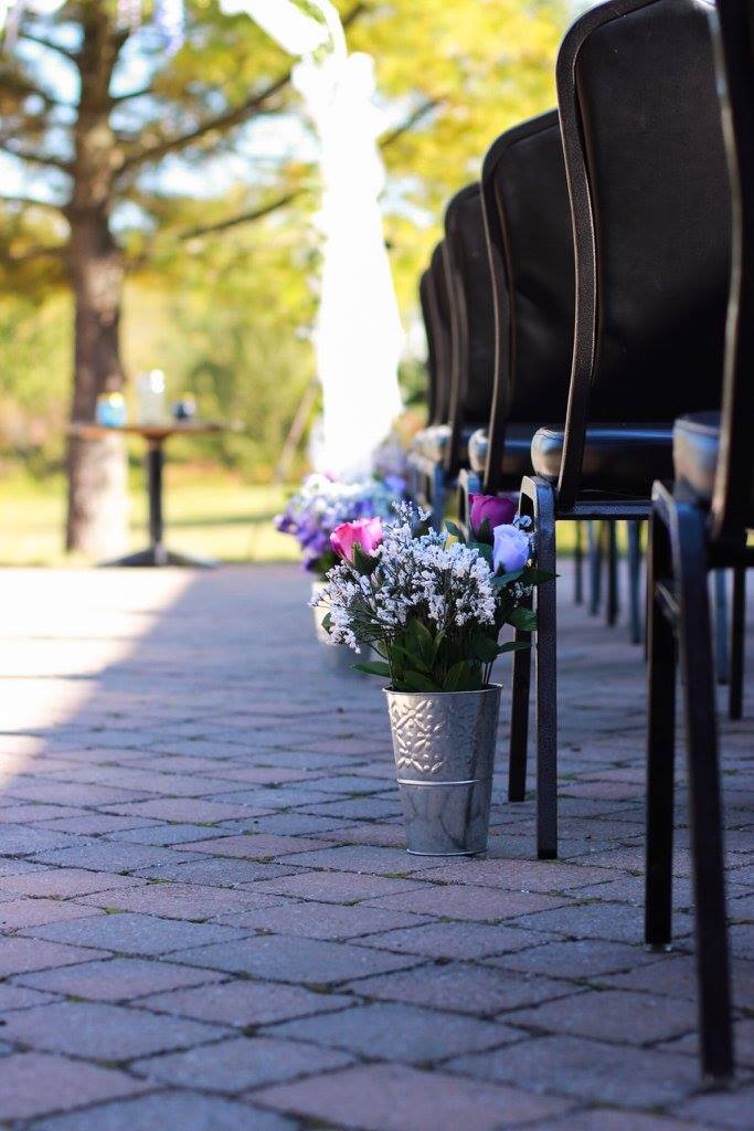 Garden set beautifully for an outdoor ceremony.