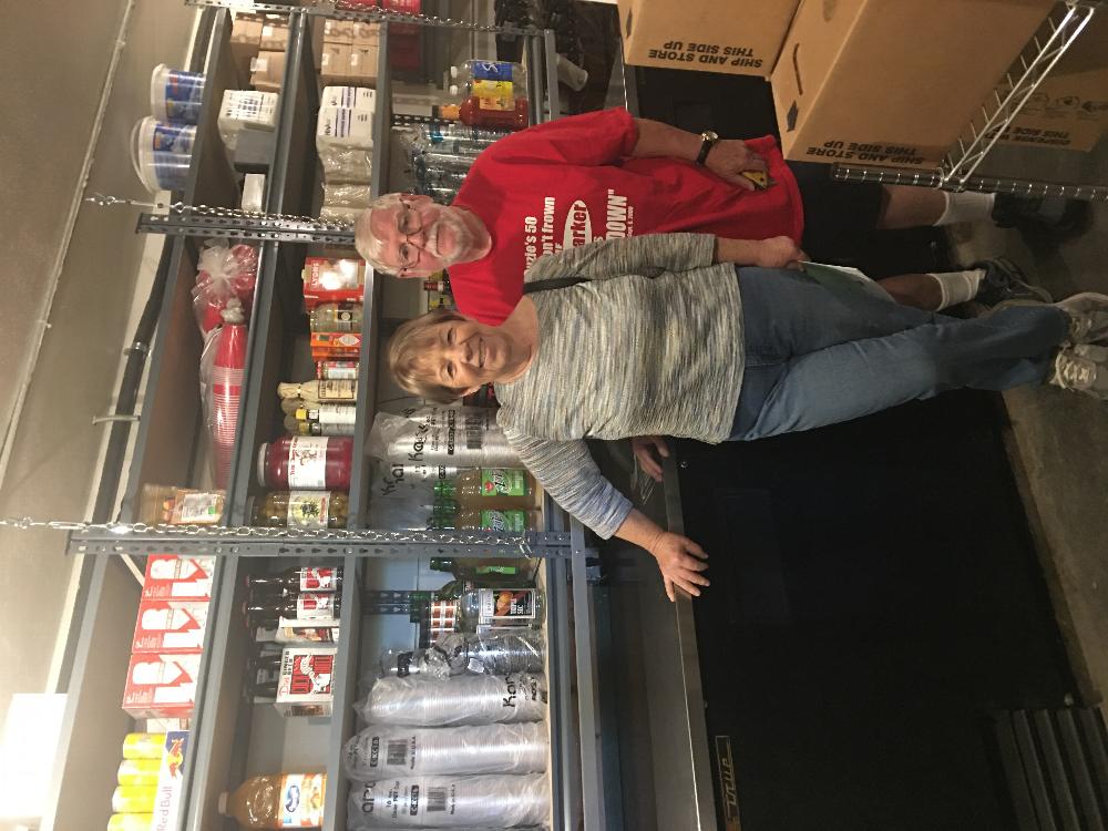 Dave & Carol Starnes and the new shelves they built in the liquor room