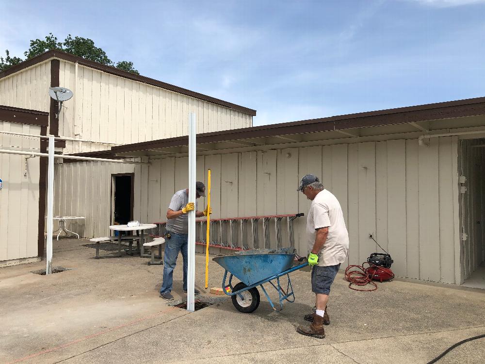 Mike Payne and Pat Stone building new poolside shade structures