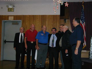 Veteran's Day Dinner 2006
Veteran Honorees (l-r) 
Julio Palacios PER, Neal Martin PAVP, PER, Ernie Flament PER, Rob Garcia, Frank Mooney PER, Fred Movey, District Veterans Committee Chairman Mike Roche PER