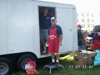 District Veteran's Chair Mike Roche PER and Bruce Keefer PER setting up for a BBQ at the Brentwood VA Hospital.