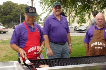 Bud Zerbe, Mike Roche PER and Bob Ridge start the BBQ at the Brentwood VA Hospital, 11/3/2006