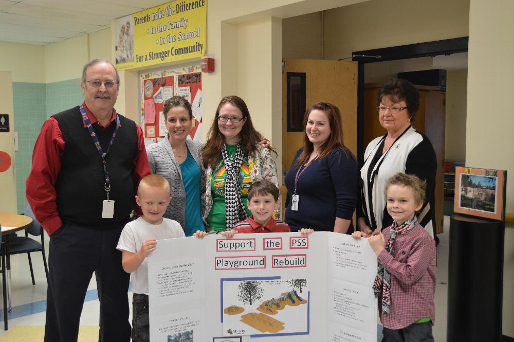 Franklin Elks donate $500 to the Paul Smith School Playground Rebuild project.  Revitilization of the playground will improve safety and make it more inviting.  The improved playground will be used by the Franklin Boys & Girls Club after-school program. Pictured from front to back and left to right are students Jacob Blanchette, Ethan Henry, and Thomas Hickey-Pfaefflin, Principal Mike Hoyt, parent/Playground Committee member Joyce Henry, 1st grade teachers Bonnie Gilbert and Kelsey Fleury, and Elks Loyal Knight Kaye Collins. 