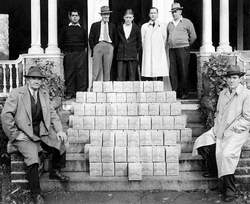 Rochester, NH Elks and boxes they packed for GIs during World War II. This was taken on the front steps of the old Wallace Mansion which served as the Elks Lodge for 40 years. Back row, from left are George Nadeau, Georgie Hayes, Pete Lachapelle, Norman Hayes, Bert Bryant. Seated on left, Mayor Walter Wood, right Mayor John Shaw.
