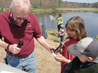 Rochester Elks Youth Fishing Derby - Prize Winner receives trophy from Dave Keller, PER, PDDGER. 