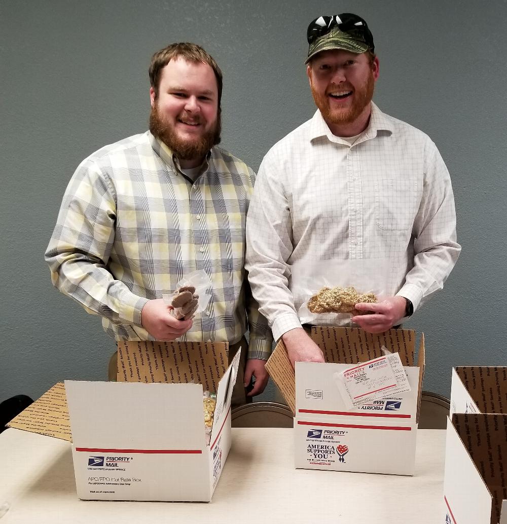 Trustee/PER Eric Pfeiffer and ER James Duncan packing cookies for soldiers overseas