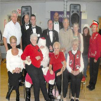 Guests at the Seniors Chritmas party along with some of the volunteers. 