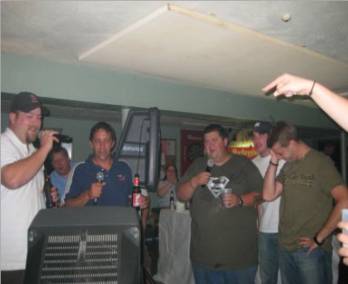 The boyz singing karaoke. Something about raining men? haha