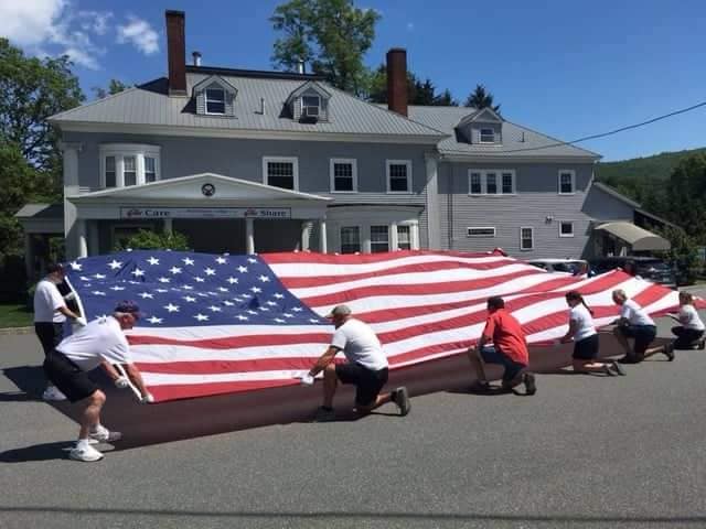 Elks Lodge #1499 displaying their Large Flag after the 4th of July parade in Brattleboro, VT
