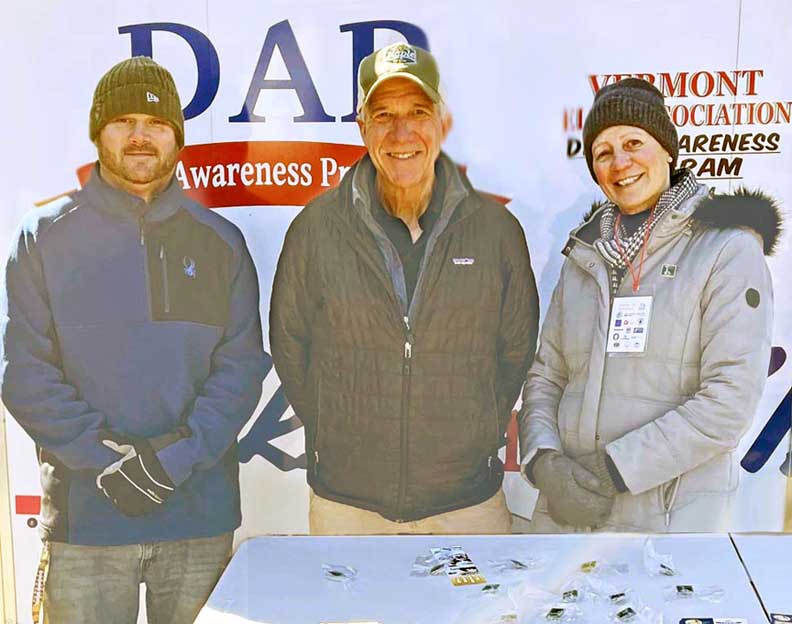 L to R:  Ryan Squires-Youth Activities Chair, VT Governor Phil Scott (his first visit to Brattleboro’s Harris Hill Ski Jump, and ER Barbara Wallace presenting Gov. Scott with an Elks Ski Jump Pin.  2/18/2023