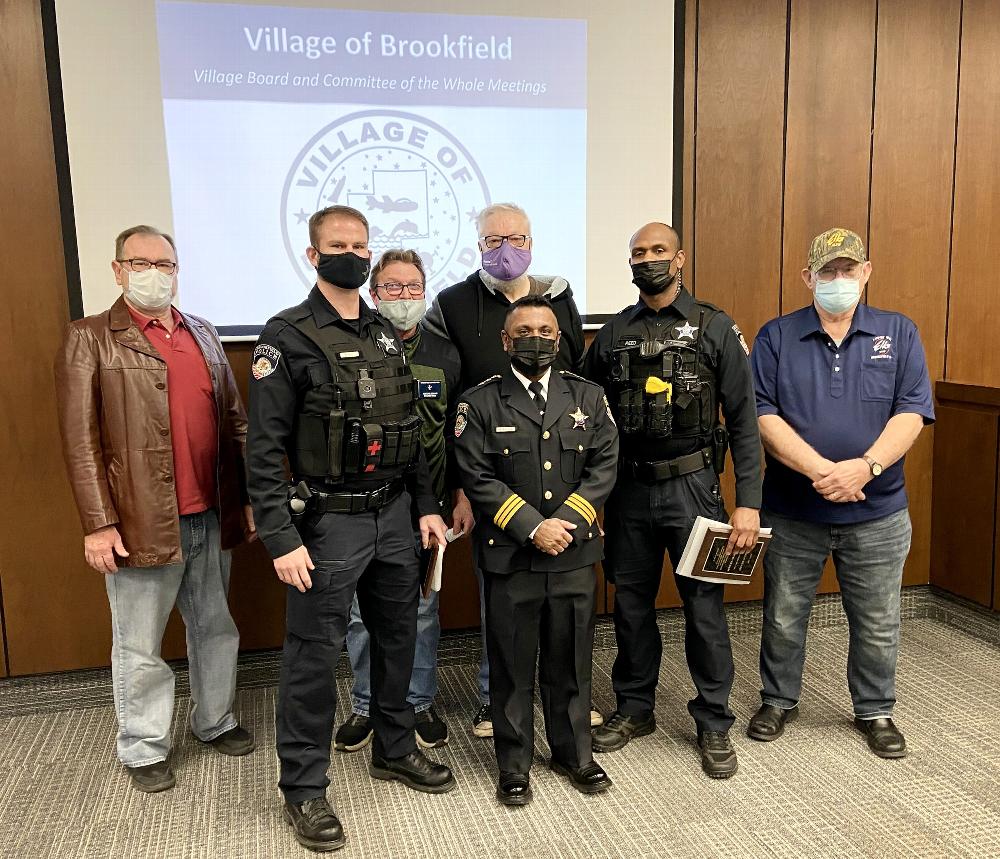 Officers Kevin Berry (second from left) and Charles Reed (second from right) were recognized for their heroics in February 2020 by Police Chief Michael Kuruvilla (front row, center) and Brookfield Elks members (from left) Rob Rolewicz, Exalted Ruler Tony Zeman, Mark Roegner and Frank Clarke