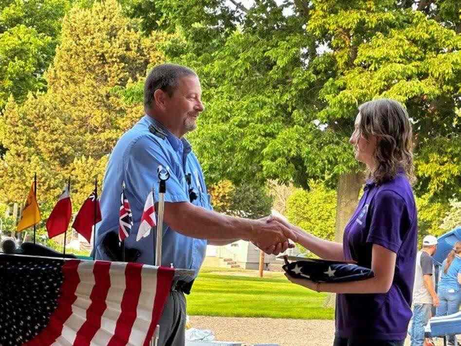 PER/Flag Day Chairman, Burton Pianalto presenting Whitehouse flag to 4-H Extension Office