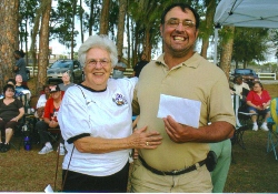 PER Heide Stover  presents a check for $531.75 to Special STARS Recreation Club President Ralph Meyers during the club's tailgating party at the South Florida Community College's baseball game on Feb. 22. The Elks raised the funds through a bingo night designated to Special STARS. Their donation will go toward the Special STARS Softball Classic coming up in March. The Elks will be one of the main sponsors. Special STARS provides sports and recreational activities for more than 250 children and adults with mental and physical disabilities in Highlands County