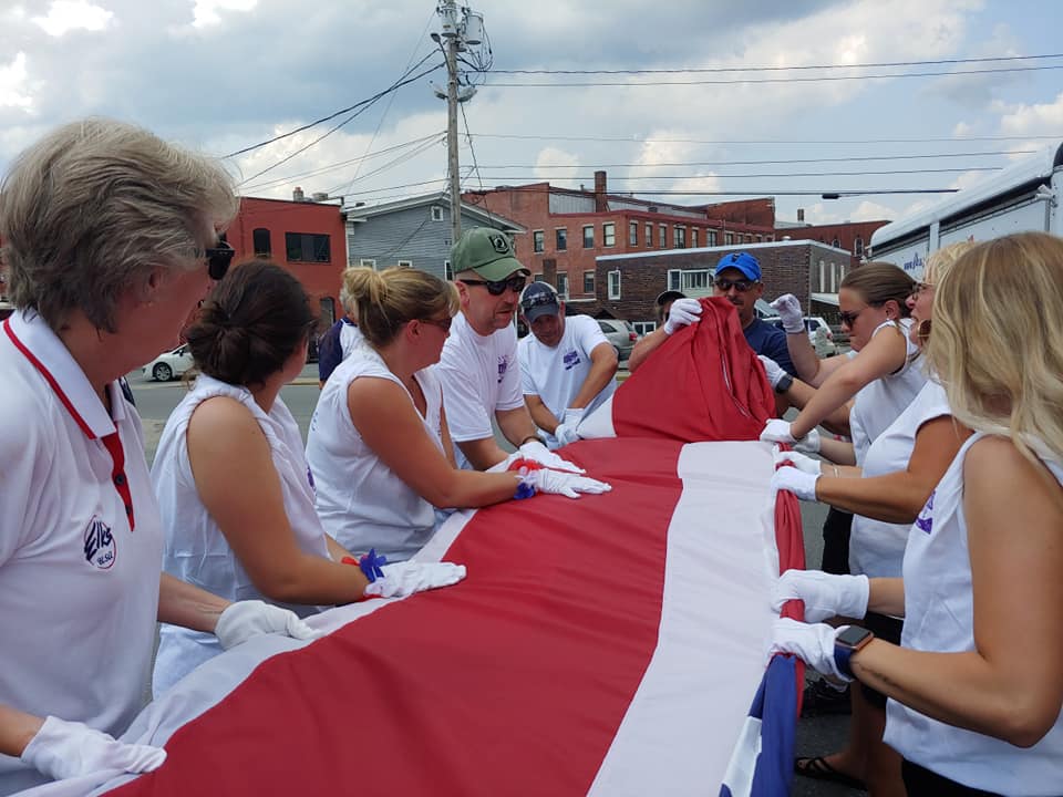 Barre Elks fold flag after marching in Barre Heritage Day Parade
