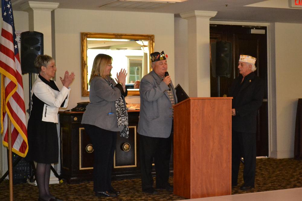 PER,ER Alyssa Nightingale, Lynne Stein PDD and Jack Stein PSVP present a citation to Commander Joe Varrone for his 25 years of service as Commander of the Plainview VFW.