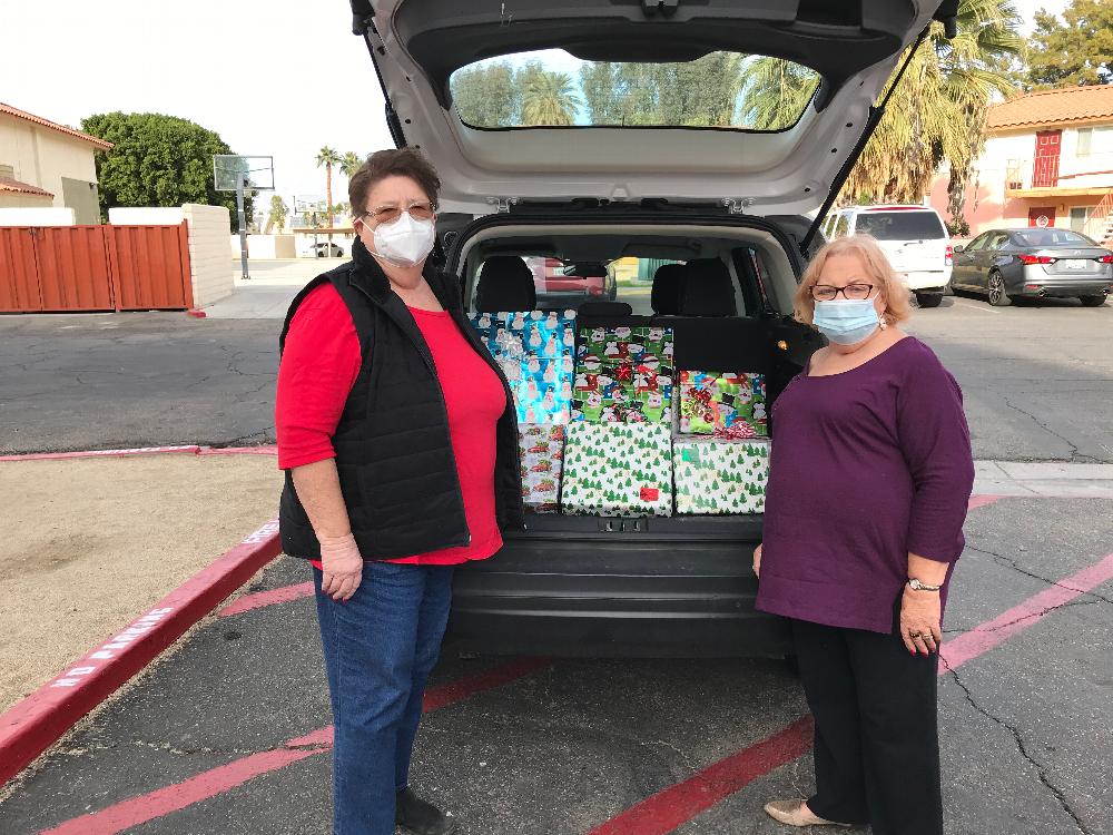 Jean Padilla, 5 year Trustee and Anita Purcell, Lecturing Knight deliver Christmas gifts to needy family in Indio.  December 23, 2020.