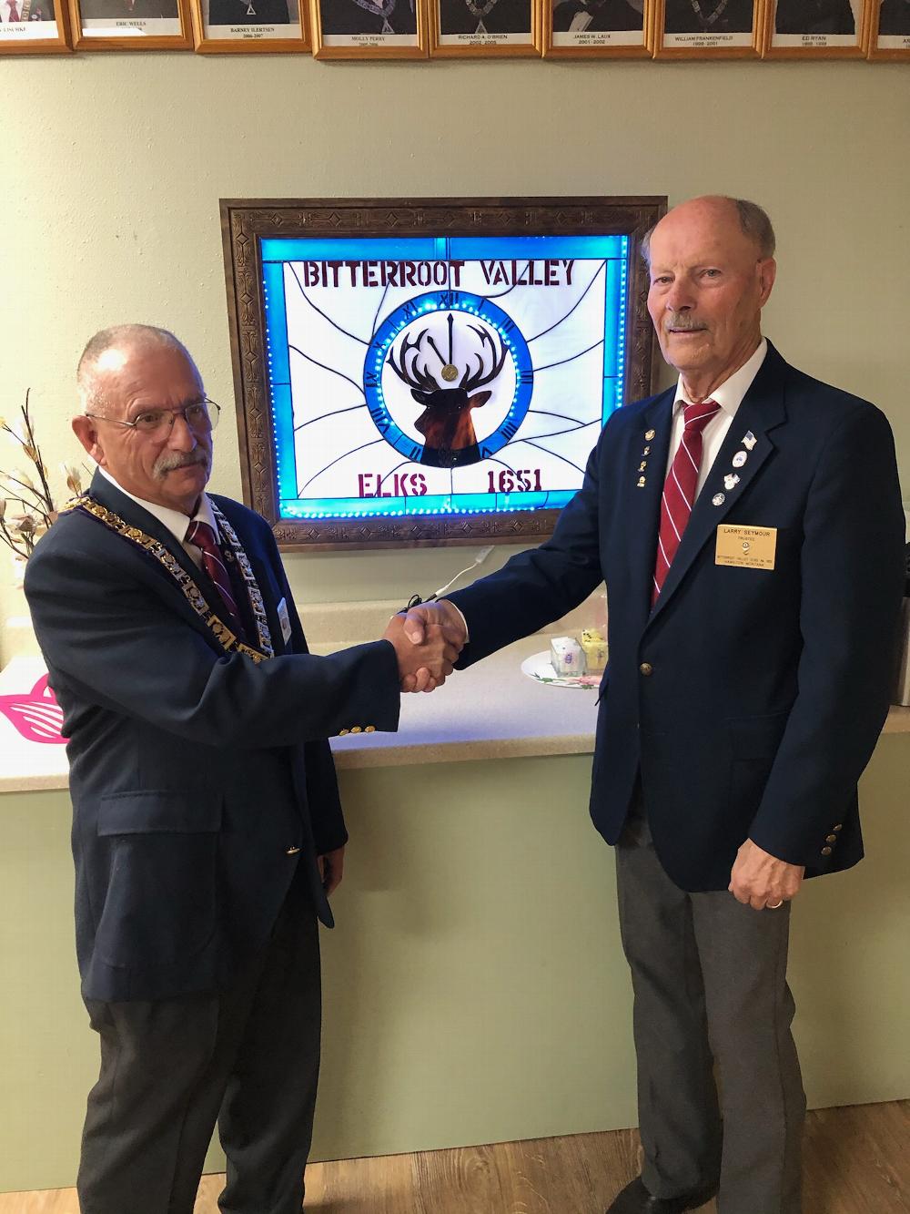 PER Phil Meis thanking Member Larry Seymour for his handcrafted stained glass sign for our Lodge.  It was placed in the Lodge dining room.