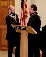 ER Zach Helmer receiving his jewels and gavel from NY State President Stuart Rishe.