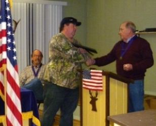 Shane Ezell was presented the Outstanding Service plaque from Joe Leming, Exalted Ruler, March 1,2011 at the Awards Cermony for his work with the local Hoop Shoot Contest, the Veteran's Markers project and other services to the organization.
