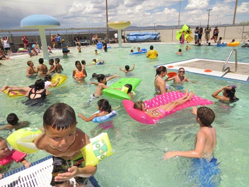 SPLASH Out Drugs delivers powerful message!
The 2015 SPLASH Out Drugs event, hosted by the Lordsburg Elks Lodge, was held June 15, 2015 at the Lordsburg Municipal Swimming Pool. The annual event offers free swimming, food and prizes for local youth while Elks members visit with the youth about the dangers of drugs and alcohol. This year’s event them was a superhero one and participants were given the message that they have the “power to splash out drugs!” The event was supported by a grant from the Elks National Foundation, as well as by the City of Lordsburg and Hidalgo County Sheriff’s Office. More than 140 youth cooled off during the event. Above, Elroy T. Elk made an appearance where he danced with children, and adults, before taking time to visit with the youngsters. Drug awareness is one of the key education components focused on by Elks across the country.
