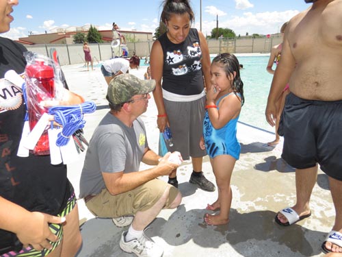 Youth were able to win numerous prizes, ranging from inflatable toys to swimming pool passes by answering questions about the dangers of drugs and alcohol. Elk member Eddie Barka quizzes the youth. Also providing drug awareness information for the kids to take home was the Hidalgo County DWI Program.