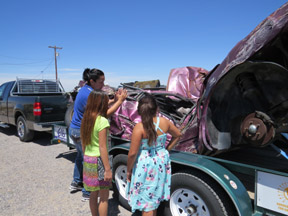 In an effort to raise awareness when it comes to underage drinking and driving, the Lordsburg Elks Lodge, in cooperation with the New Mexico Elks Drug Awareness Program, had this MADD vehicle on display last Saturday, prom day in Hidalgo County. The vehicle display was part of the day’s events at the Elks Lodge, which included a presentation by Toni Hernandez of Las Cruces’s Shattered Lives program. Students in attendance at the one hour presentation won prizes and were able to take a close look at the MADD vehicle, which was last driven by three Las Cruces teens who made the bad decision to drink and drive. Two of the teens died at the scene of the accident and one survived after spending more than a month in the hospital. Above, Lordsburg Elks Lodge Youth Activities and Drug Awareness Chairman Maria Sanchez points out details to Angel Alvarado and Aleah Armendariz before the presentation begins. 
