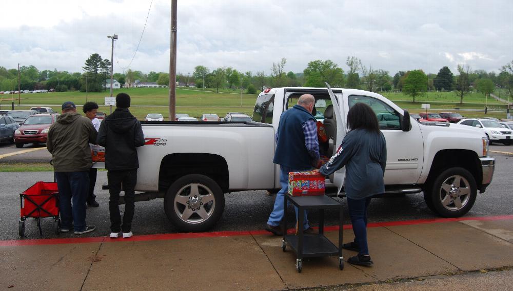 <b>Mrs. Harper’s 2nd period gym class rolled out carts and helped to unload and deliver the items to the staging area inside the school where they would be used to fill backpacks for children in need.</b>