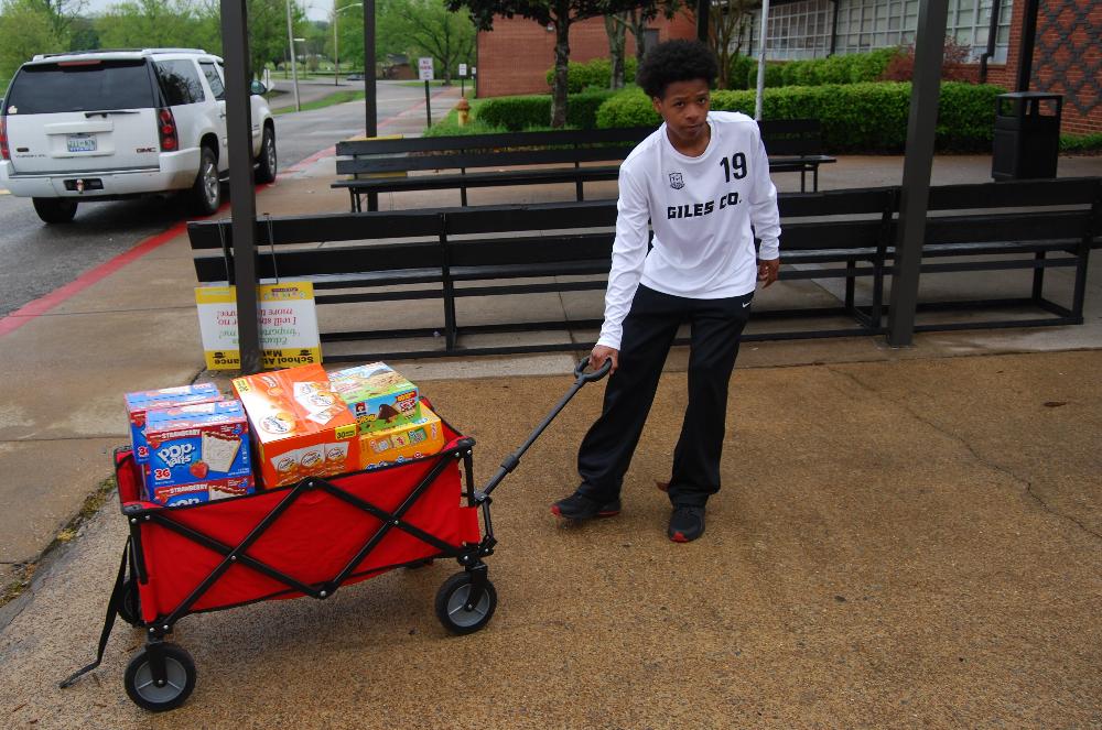 <b>Trucking more merchandise into the school.</b>