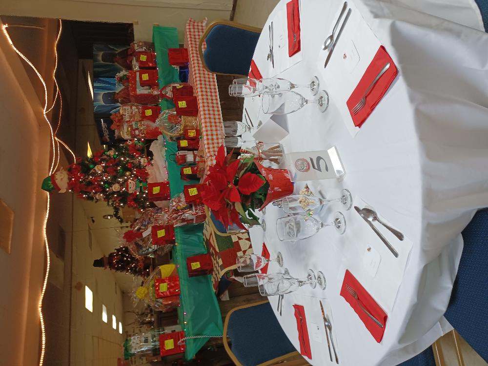 beautiful Table Setting with Donated Items in background