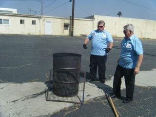 Tom Hargreaves and Tom Troutman burning the retired flags